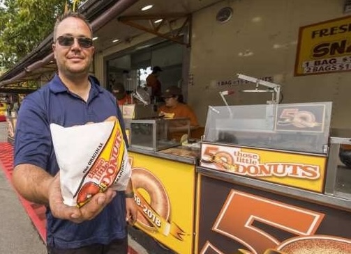 Customer holding donut bag